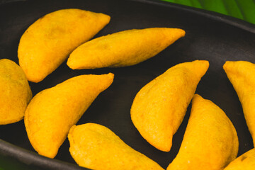 Colombian empanada with spicy sauce 