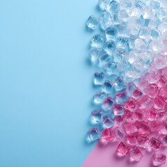 Ice cubes transition from blue to pink on colored background. Top-down view with empty space