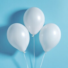 Three white balloons tied with string against a vibrant blue backdrop