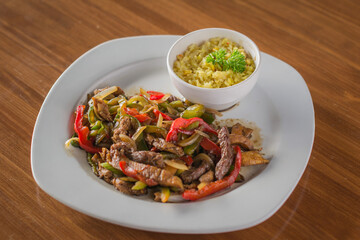 Classic Mexican Beef Fajitas with Peppers, Onions, and a Side of Rice