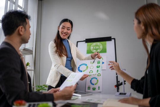 Business professionals discussing esg strategy during corporate meeting - Powered by Adobe