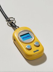 Bright yellow handheld device with a digital display.  A lanyard attaches to it.  The word "mode" is prominent on the screen and the body