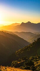 Sunlit Mountain Range Landscape with Golden Hues Layers of Hills Trees and Blue Sky Panoramic Vista in Warm Cinematic Light