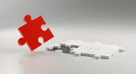 Two Red Puzzle Pieces Connecting in the Middle of White Jigsaw Puzzle
