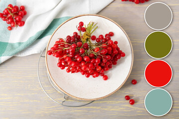 Plate with fresh viburnum berries on table