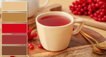 Cup of healthy viburnum tea on table