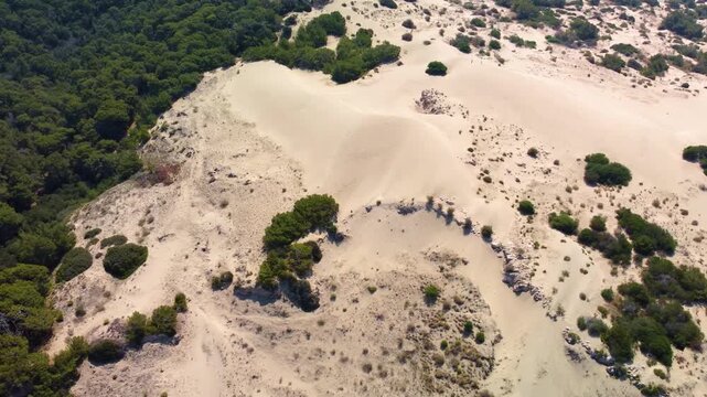 Experience the breathtaking beauty of Patara Sand Dunes and the adjacent Patara Beach in Antalya Province, Turkey, captured from an aerial perspective during the golden hour.