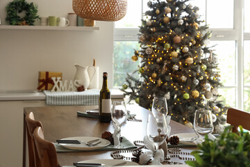 Christmas table setting in kitchen interior