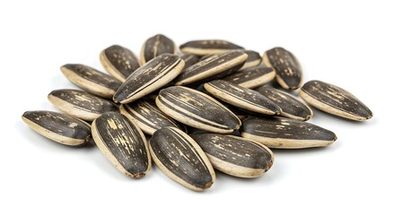 Pile of striped sunflower seeds on bright white background, macro shot
