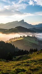 Sunrise Over Mountainous Landscape with Rolling Fog and Sunlight in Golden Hour with Green Forest and Grassy Foreground and Clouds