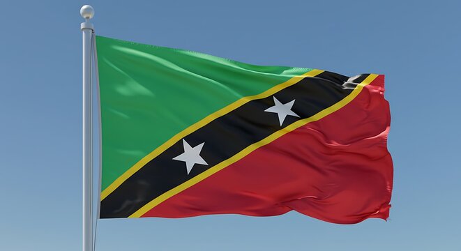 Saint Kitts and Nevis waving flag on flagpole against clear blue sky