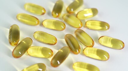 softgel Fish oil capsules with omega 3, omega 9, vitamin D, vitamin E, oval gelatin capsules - Powered by Adobe
