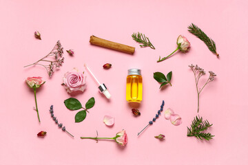 Composition with bottle of essential oil, cinnamon stick and different flowers on pink background