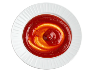 Red and yellow sauce swirl on a white plate