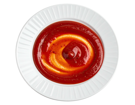 Red and yellow sauce swirl on a white plate