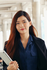 Fototapeta premium Vertical Horizon Portrait Asian women happiness smiling laugh happy person looking at camera. Beautiful happy girl portrait joy cheerful. Vertical Confidence females candid shot smiling face
