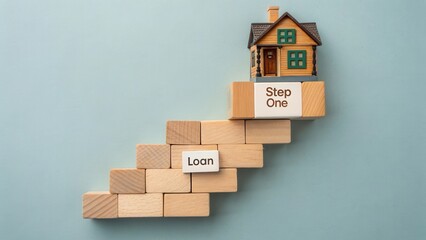 Fototapeta premium Small model house on wooden blocks representing steps to securing a loan for home ownership in financial planning and real estate