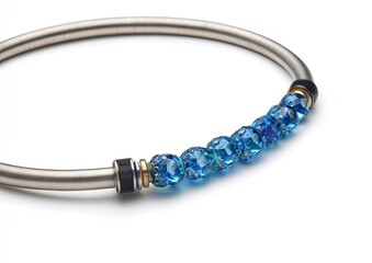 Fototapeta premium A close-up of a silver bracelet adorned with vibrant blue, faceted beads