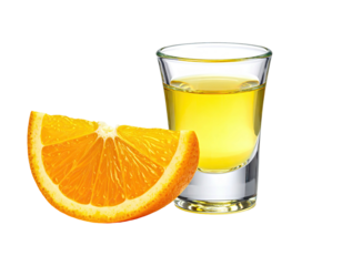 A shot glass of yellow liquid beside a slice of orange