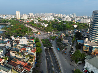 Aerial cityscape of Hanoi with Kim Lien street, buildings, and green spaces.
