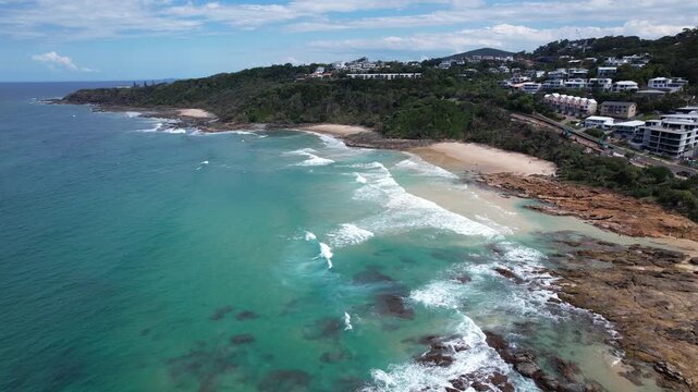 Small Beaches With Rough Waves Hitting The Rocky Coastline In Coolum Beach, QLD, Australia. - aerial shot