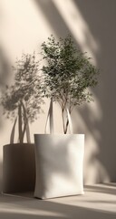 Cream tote bag with small tree, sunlit
