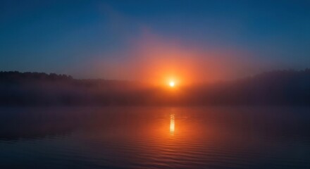 Obraz premium Sunrise over misty lake