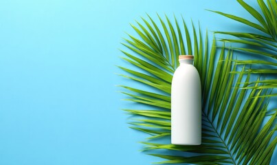 White bottle with wooden cap rests against green palm leaves on a blue background