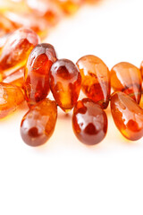 Hessonite Garnet Faceted Briolette Beads on White Background