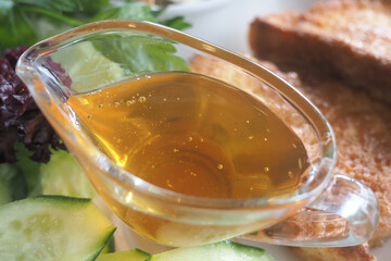 Delicious honey served with fresh vegetables and toast