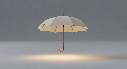 Isolated umbrella with handle projecting subtle glow on neutral backdrop