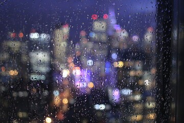 Obraz premium Rainy Night City Lights View Through Window