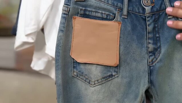 close-up view of blank, textured leather label typically used for branding and tagging denim jeans