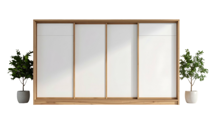 Wooden sliding door cabinet with white panels, framed in a light brown wood, is placed on a stark black background, flanked by two potted green plants, creating a minimalist and modern aesthetic.