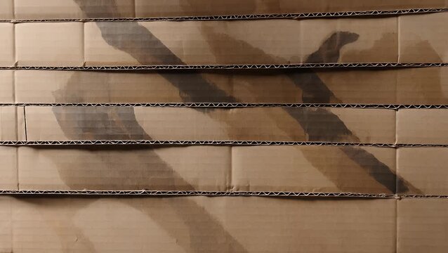 Textural Background Composed of Multiple Stratified Layers of Corrugated Cardboard from Box, Showing Printing Registration Marks and Shadow Effects