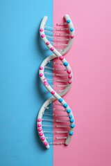DNA model pink/blue background, double helix, pink/blue beads