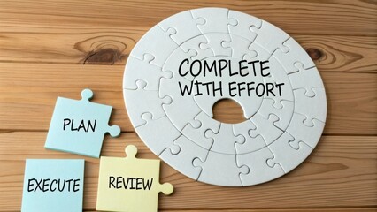 Puzzle with words complete with effort, plan, execute, review on sticky notes on wooden table background
