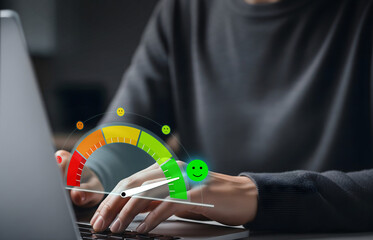 User Satisfaction Meter in Digital Feedback Interface, Laptop with emoticon gauge showing high satisfaction level