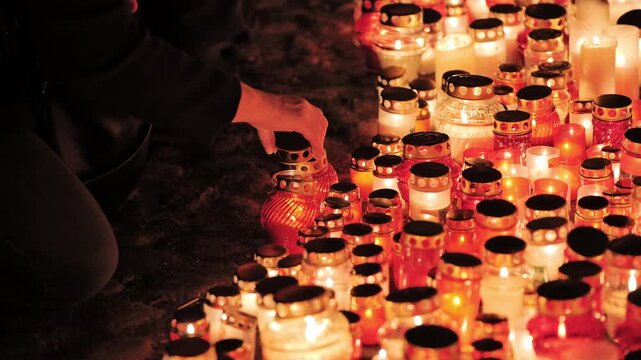 Hundreds of candles glow, Riga Latvia during Lacplesis Day patriotic remembrance