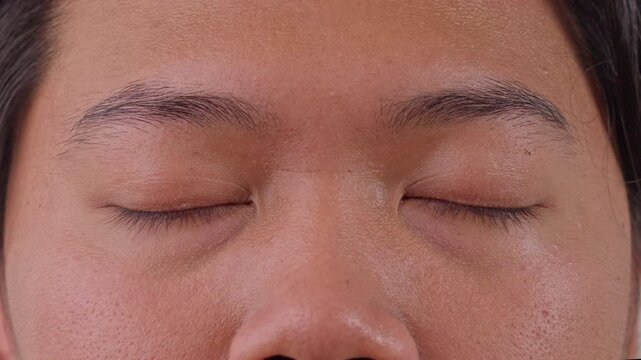 Compilation Close up of young asian man opened eye in front of camera