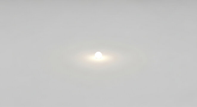 Bright light source in gray sky background for abstract concept and minimalist design resource use case