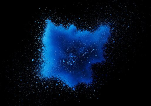 A vibrant explosion of blue powder against a stark black background, creating a dynamic and abstract cloud-like shape with scattered particles. - Powered by Adobe