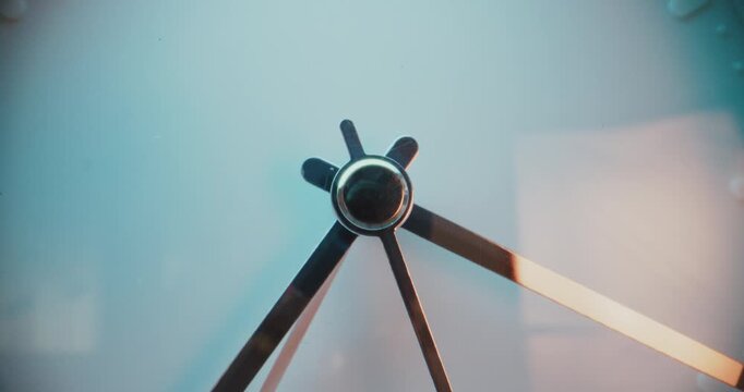 Close Up Shot of Moving Clock Hands Showing Precise Time on Minimalist White Wall Clock. Contemporary Design Element of Interior in Warm Light. Concept of Time Management and Punctuality. Time Lapse.