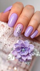 Close-up of manicured nails with a delicate flower