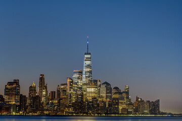 The skyline of Lower Manhattan with the famous World Trade Center during blue hour