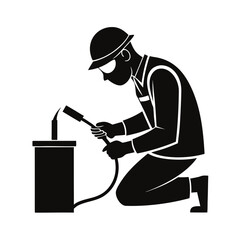 Welder working with torch in silhouette
