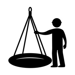 Person interacting with a large hanging circular object silhouette