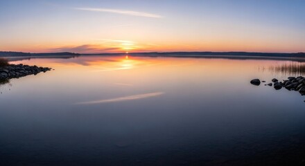 Naklejka premium Serene Lake at Sunrise Reflective Water and Tranquil Atmosphere
