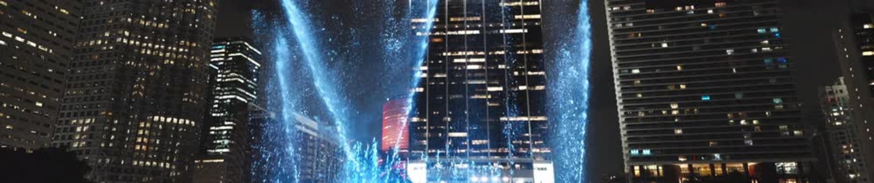 water fountain neon lights skyline city Miami night