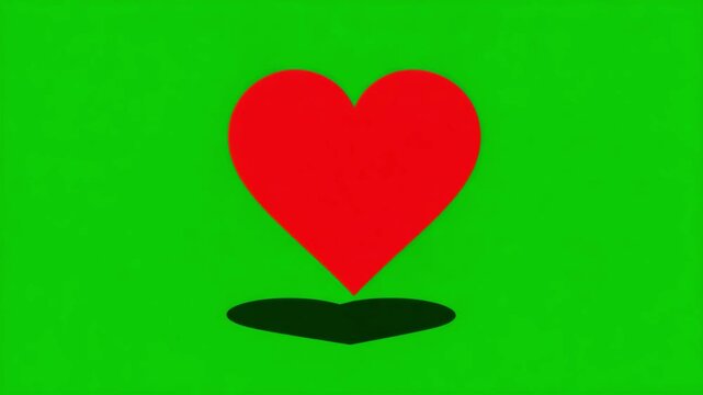 Red heart shape casting a dark shadow on a vibrant green background simple graphic element for